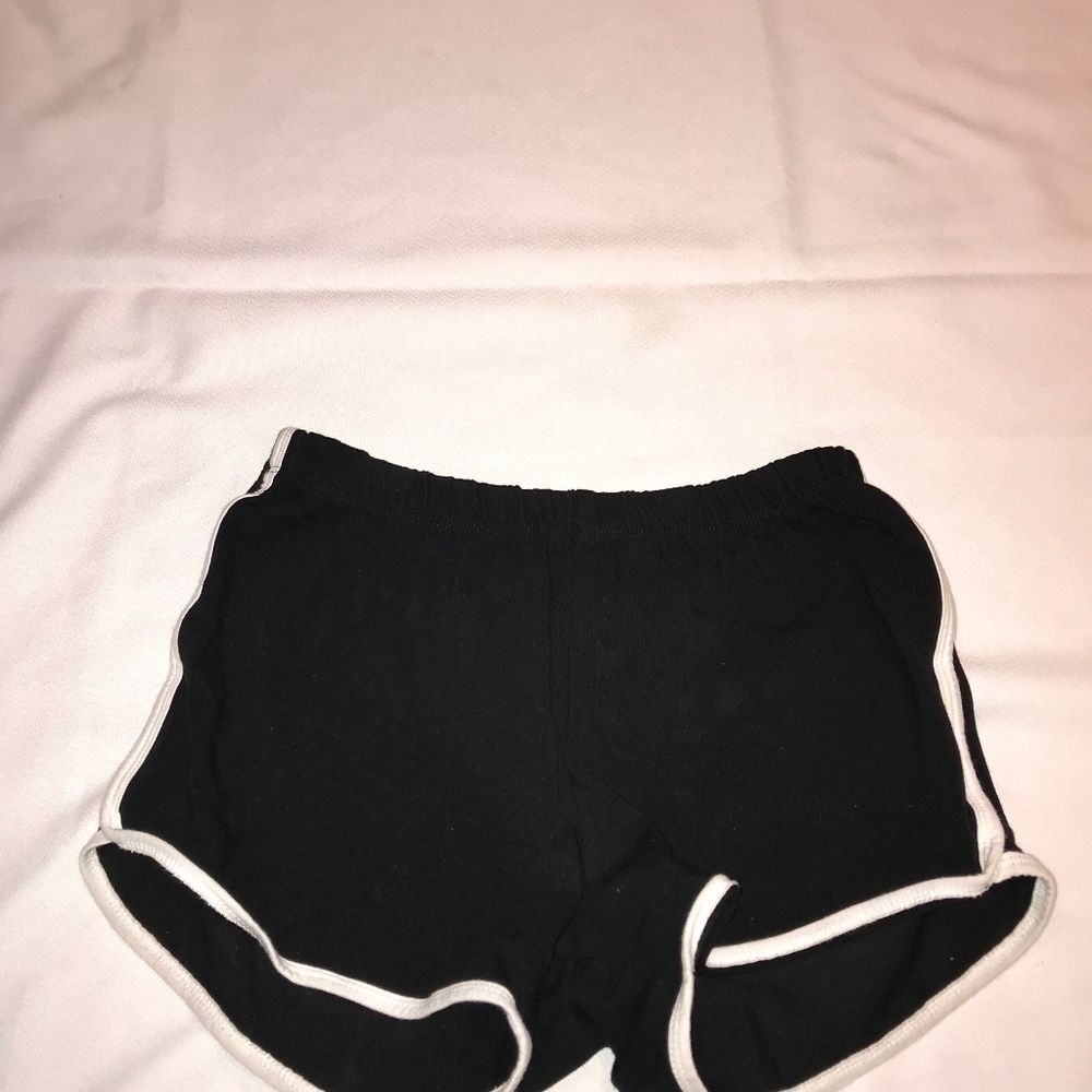 black shorts with white trim detailing